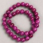 Raspberry-tinted acrylic beads on beading thread, smooth round beads, diameter 10.5 mm, length 40 cm