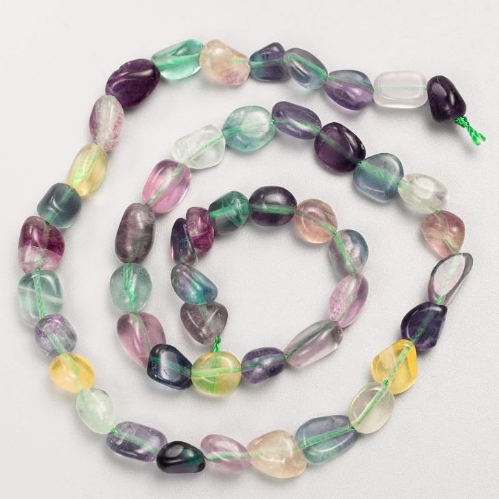 Beads on a thread of natural fluorite, tumbled, 8x9 mm, length 40 cm