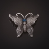 Silvery Butterfly Brooch with Gray Stones and Blue Eyes, 3 cm
