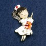 Brooch 'Nurse', white, black, and red enamel, golden metal 42x31 mm