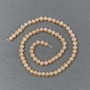 Peach river pearls on a strand, diameter 5–6×5–4 mm, length 36 cm