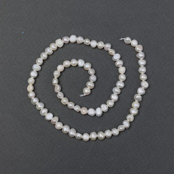 Freshwater pearls with gasoline shade on a thread, diameter 5.5×4.5 mm +/-, length 37 cm +/-