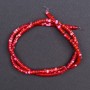 Tinted red mother-of-pearl beads, disc-shaped, 4x2 mm, about 40 cm long on a beading thread