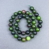 Zoisite beads, smooth spheres, 10.5 mm diameter, on thread, 39 cm length