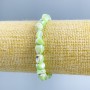 Bracelet with light-green mother-of-pearl, faceted beads, 8x6 mm diameter, length 18 cm (stretch)