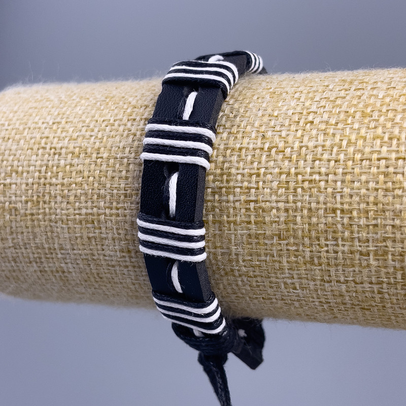 Bracelet, length 18-25 cm, thickness 14 mm, eco-leather, black with white clasp