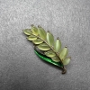 Twig Brooch with Green Cat's Eye, Green Enamel on Gold-Tone Metal 22×47 mm
