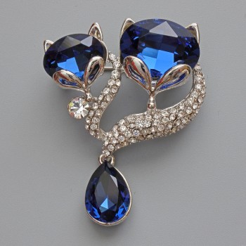 Brooch-pendant 'Foxes' with blue crystals, white rhinestones, silvery metal 37x35 mm