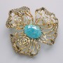 Brooch-pendant Flower with blue aquarium effect, white crystals, golden metal 51x51mm