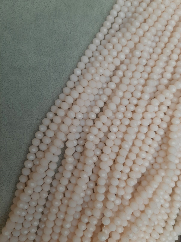 Beads Czech Crystal Light Pink Faceted Rondelle, diameter 6x5 mm, length 43 mm on beading thread