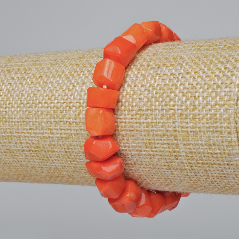 Orange natural coral bracelet with faceted beads (assorted, medium size), diameter 12x9 mm, length 18 cm +/- (stretch)