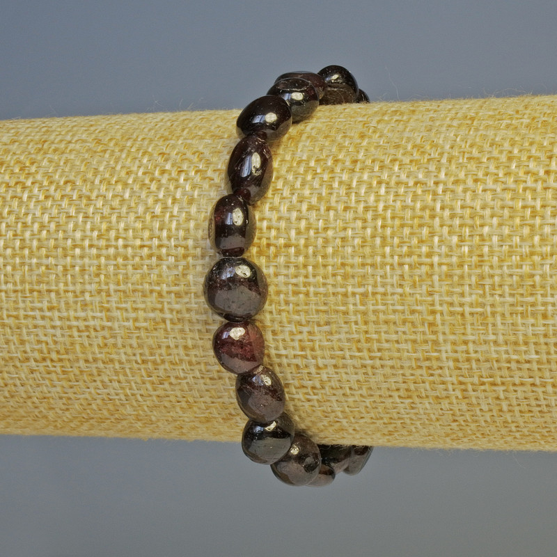Garnet bracelet, natural stone, faceted, diameter 11×9–8×7 mm, length 18 cm, stretch