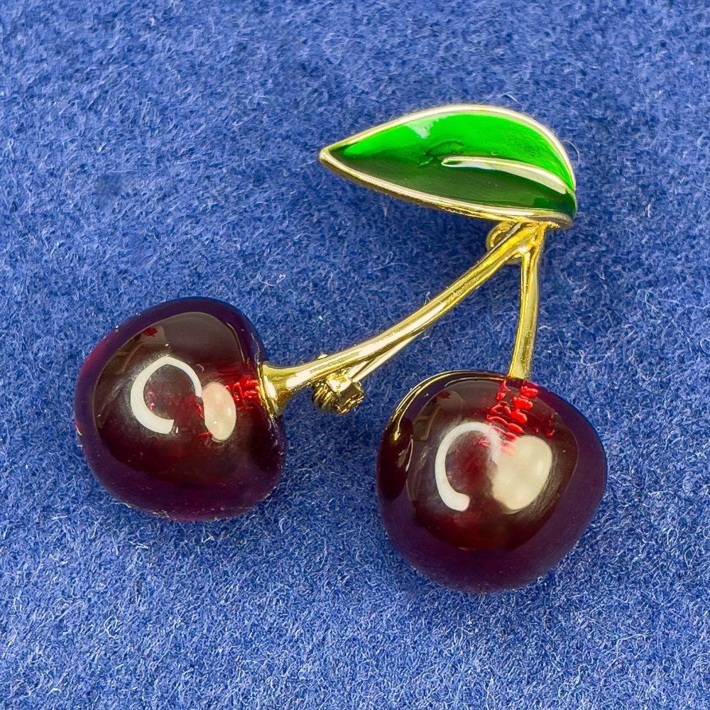 Brooch 'Cherries' with green enamel and gold-tone metal, 40×35 mm+