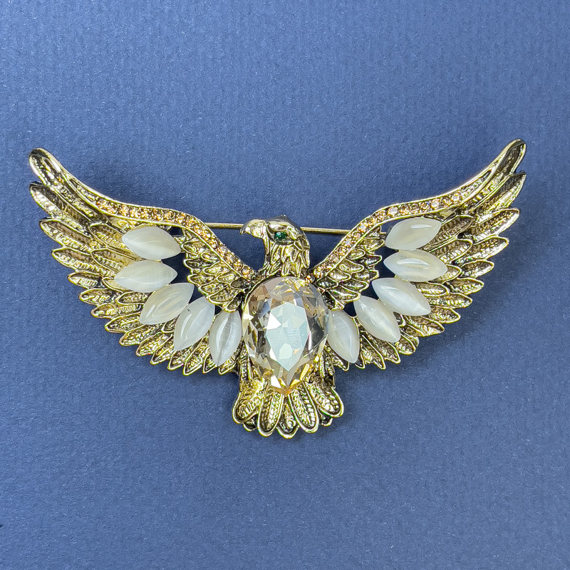 Brooch-pendant Eagle with Cat's Eye and yellow crystal, golden metal 44x73mm+
