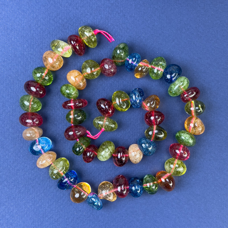 Assorted gemstone beads, faceted, 12x8-10 mm on thread, length 40 cm+
