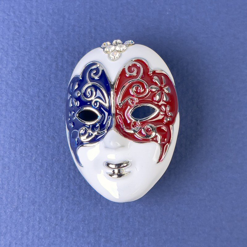 Brooch 'Mask' with white, black and burgundy enamel, white crystals, silvery metal 27×39mm+