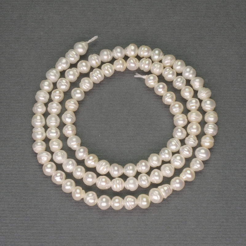 Freshwater white pearls on a thread, diameter 4×3.5 mm, length 36 cm