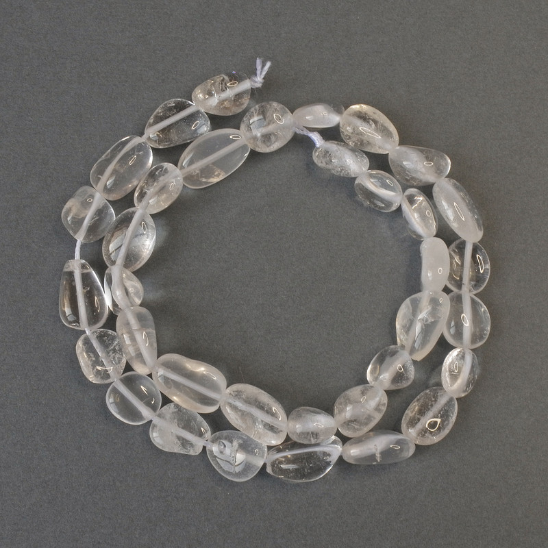 Beads of mountain crystal, faceted, diameter 9–14×9 mm, length 40 cm on cord