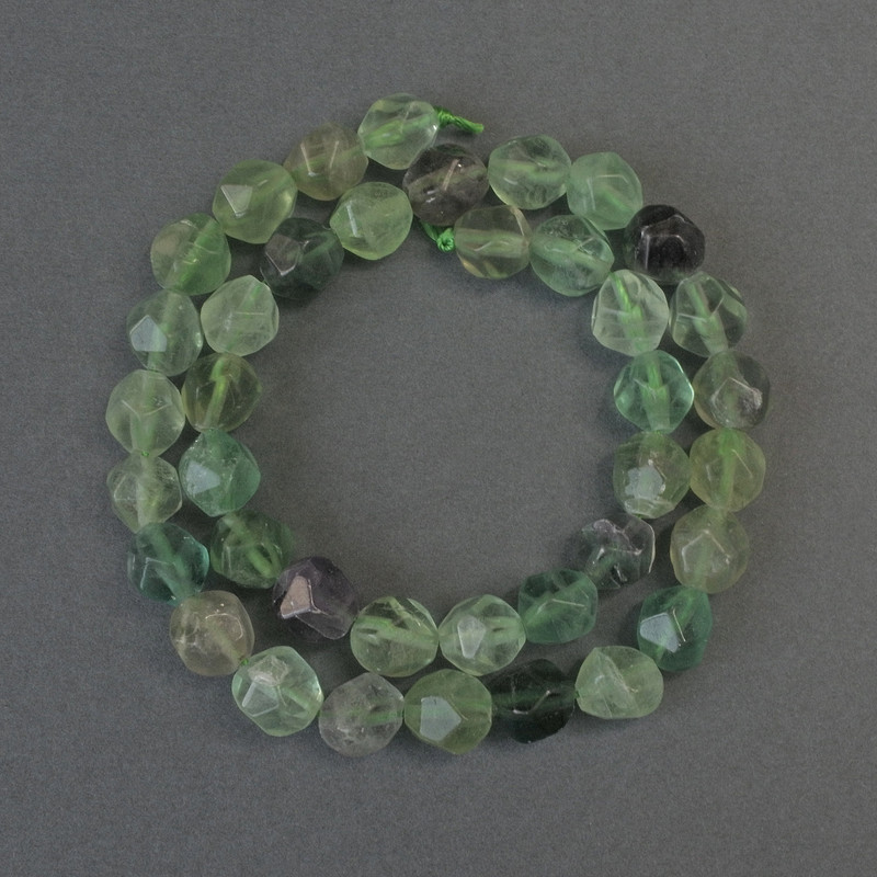 Fluorite beads, faceted, 10×8 mm diameter, 37 cm long on a thread