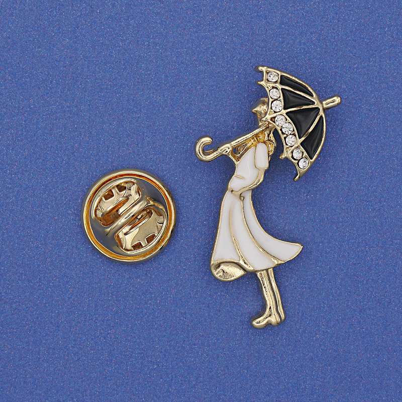 Brooch 'Girl with a Parasol' with white crystals, white enamel, golden metal, 32×16 mm+