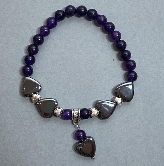 Amethyst bracelet with smooth beads 6mm +/-; Hematite heart 12mm +/-; with metal inserts Length 18mm +/- Stretch