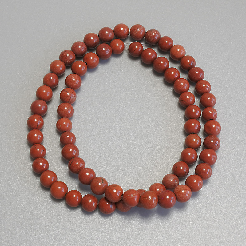 Red jasper beads, smooth round spheres, 6 mm diameter ± on thread, length 37 cm+