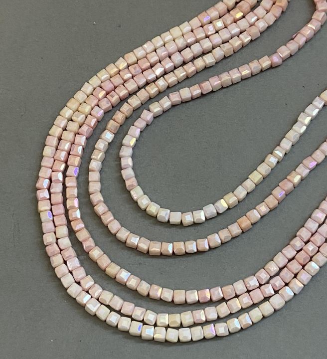 Beads Czech Crystal pink with 'gasoline' coating on thread, faceted cube, diameter 4x4 mm + -, length 38 cm +