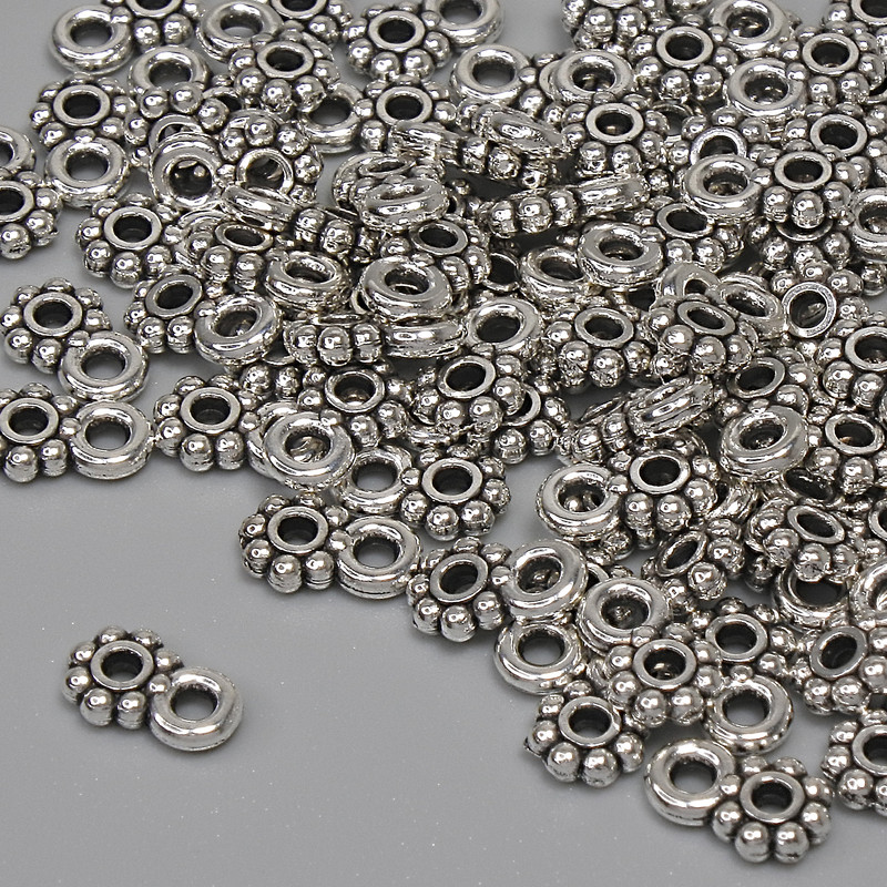 Pendant in silver-colored metal, diameter 7×4.5 mm, bail opening 1.5 mm, packaging 84 pcs