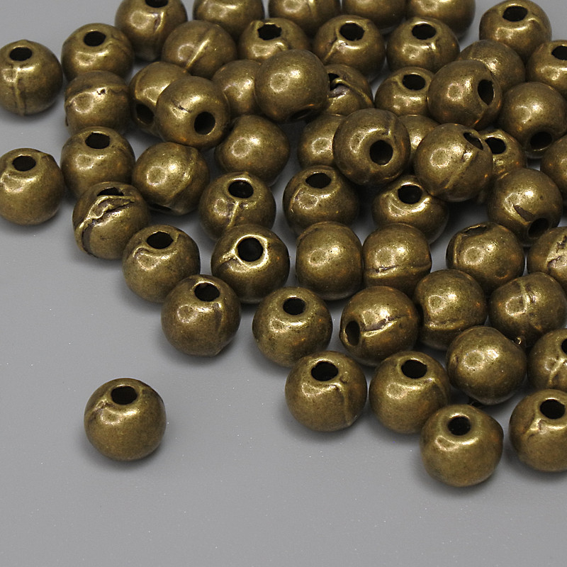 Bronze-colored bead insert findings, 5×4 mm diameter with 1.5 mm hole, packaging 60 pcs.