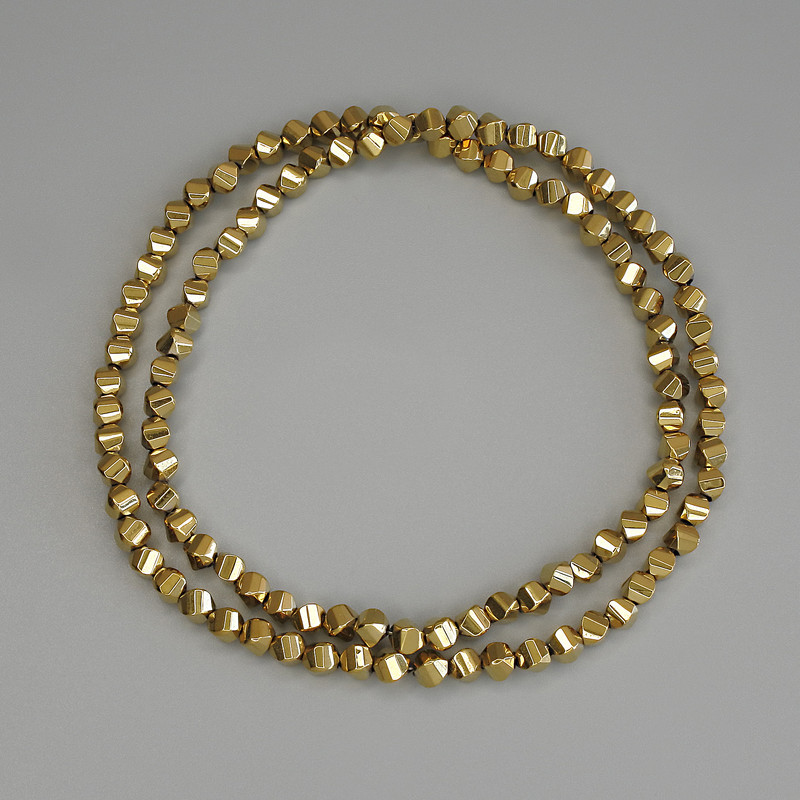 Gold-colored hematite beads, diamond-shaped 4×4 mm, on a beading thread, length 40 cm+