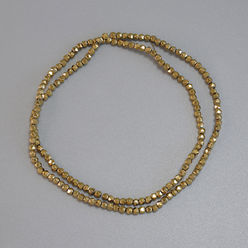 Gold-colored hematite beads, 2x2mm, faceted, on thread, length 38 cm+