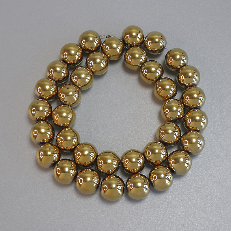 Gold-colored hematite beads, smooth round 12mm ± on a thread, length about 40 cm ±