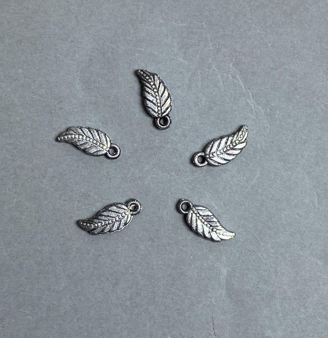 AUCTION! 0.5 kg Packaging Leaf Pendant - Plastic - Dark Silver color - Dimensions 17x7x3 mm; hole diameter 2 mm