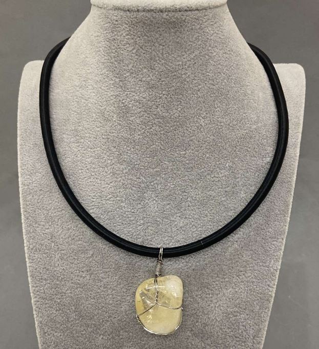 Citrine pendant in a woven setting, 20x30 mm, on a rubber cord with a 5 mm diameter, 45 cm + 5 cm extender chain