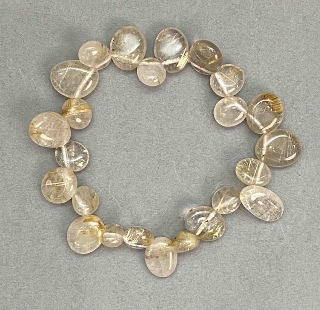 Bracelet of Rutilated Quartz 'Hair Quartz' Faceted Butterfly Beads 10-15×9-11 mm, length 18 cm, stretch