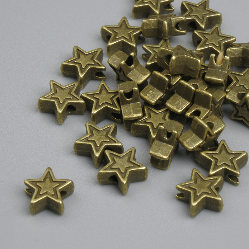 Star-shaped bead insert in antique bronze color, 6×2.5 mm, hole diameter 1.5 mm ±, packaging ~25 pcs.