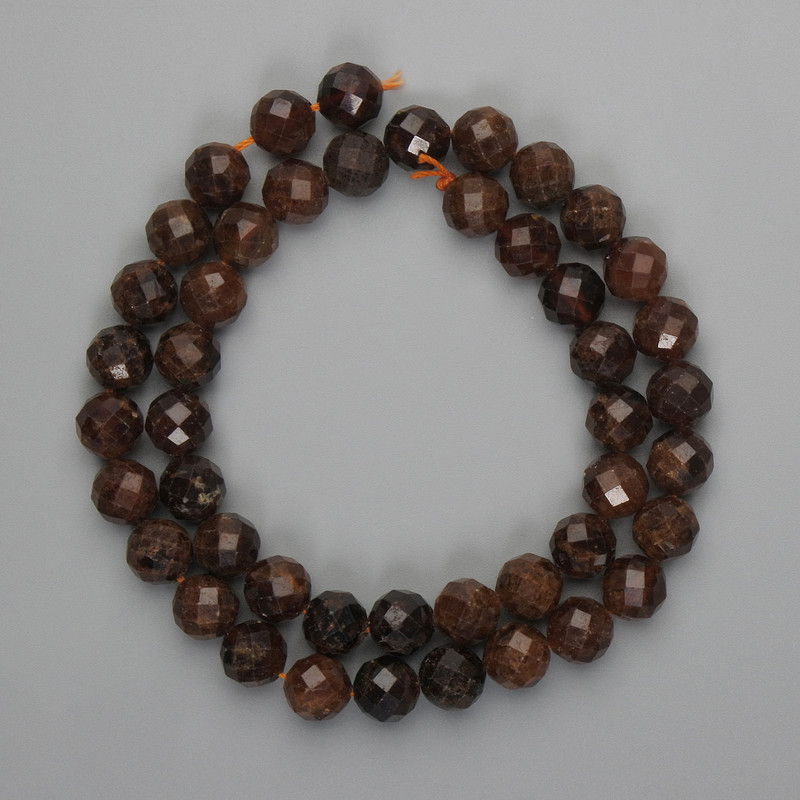 Goshenite beads, faceted, 8.5 mm on a thread