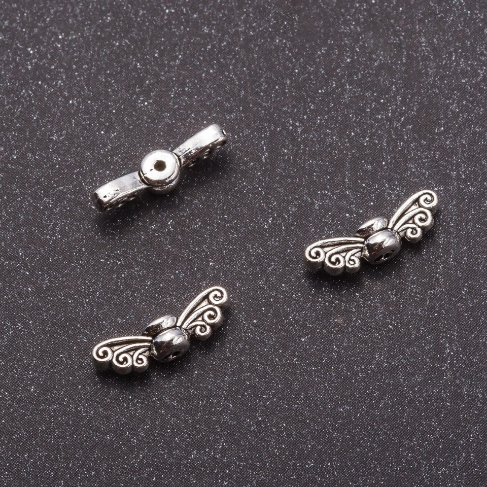 Findings insert 'Butterfly Wings' 4.5×14 mm, hole diameter approx. 1 mm, ±26 pcs