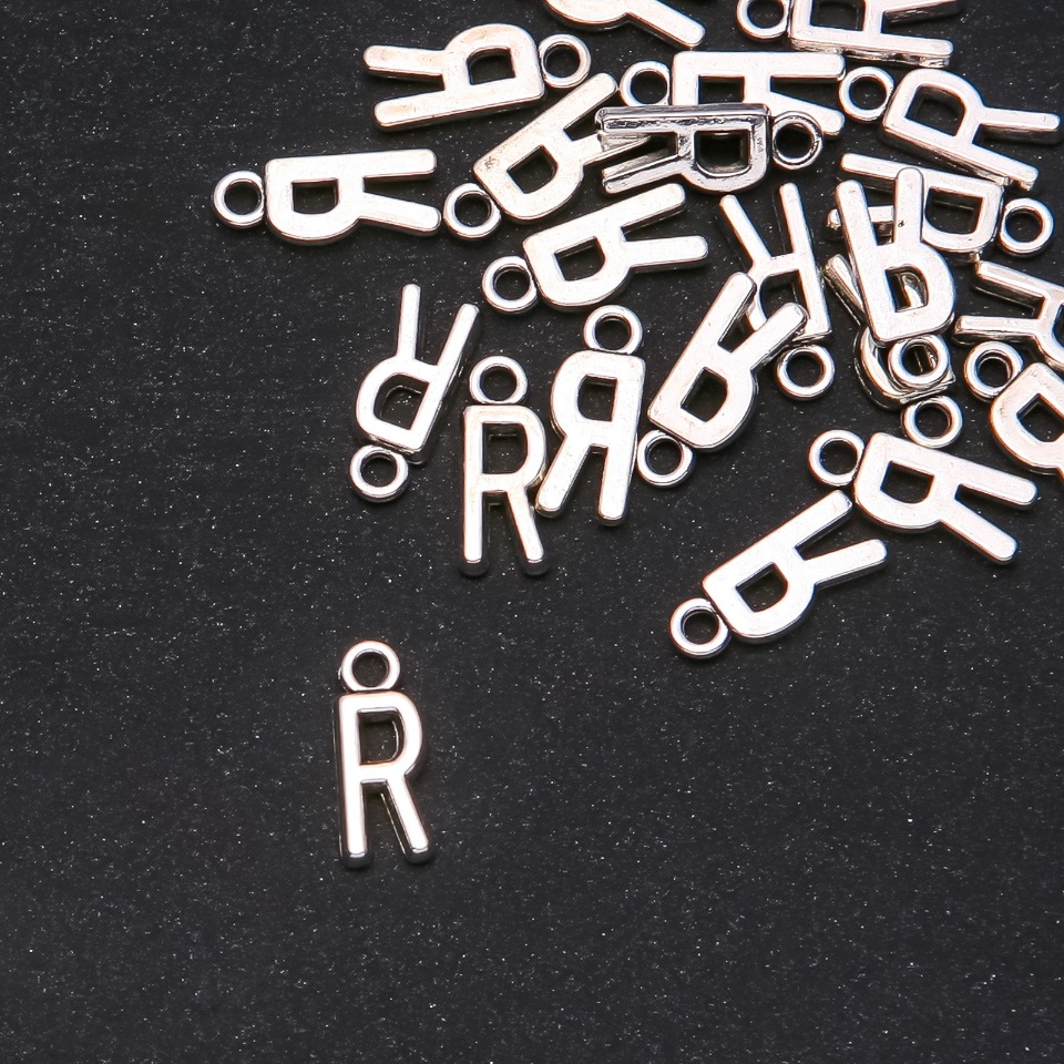 Pendant findings Letter 'R' 17x7mm, packaging 20 g (±25 pcs)