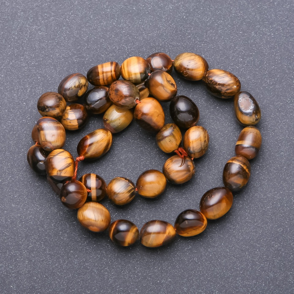Beads on Thread - Natural Tiger's Eye - Faceted, Diameter 9–12×8 mm, Length 38 cm