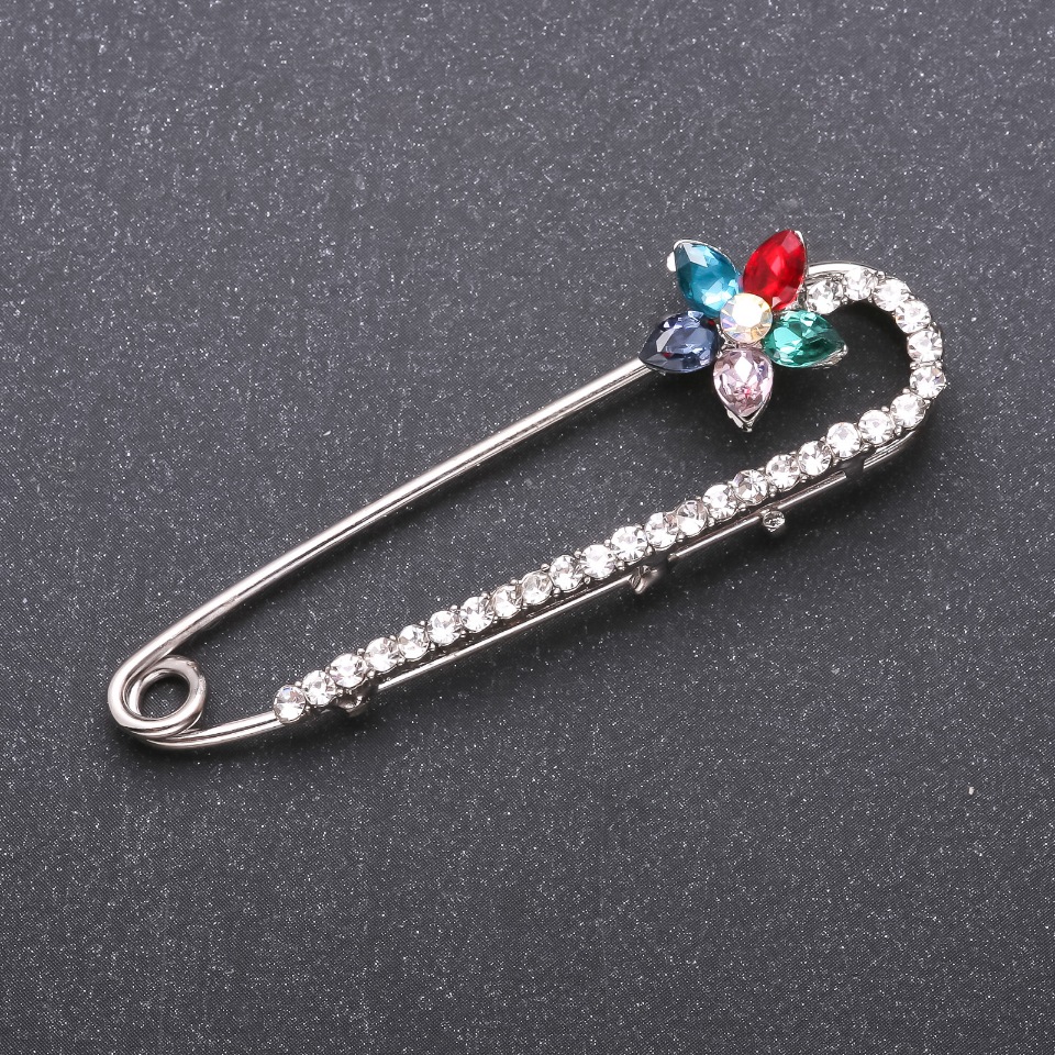 Brooch pin with multicolored glass crystals, 64x19 mm, white metal