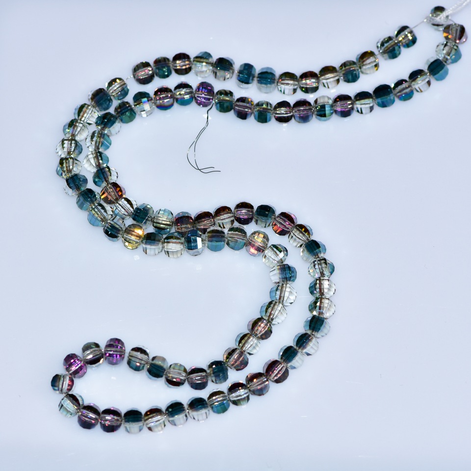 Crystal Beads in Swarovski Style, light brown faceted spheres with Green Petrol coating, diameter 5×4 mm, strand length 4