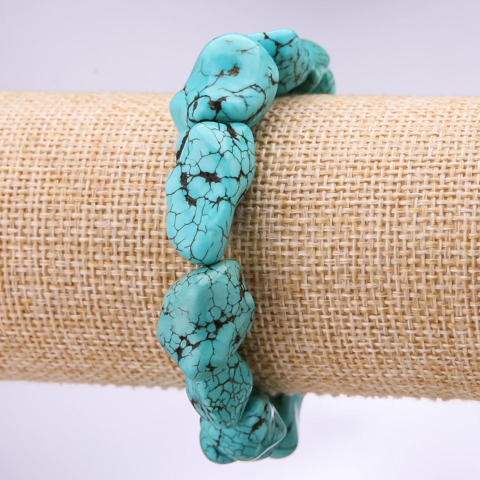 Bracelet 'Turquoise' (howlite) faceted, diameter 15–20 mm, length 18 cm on elastic