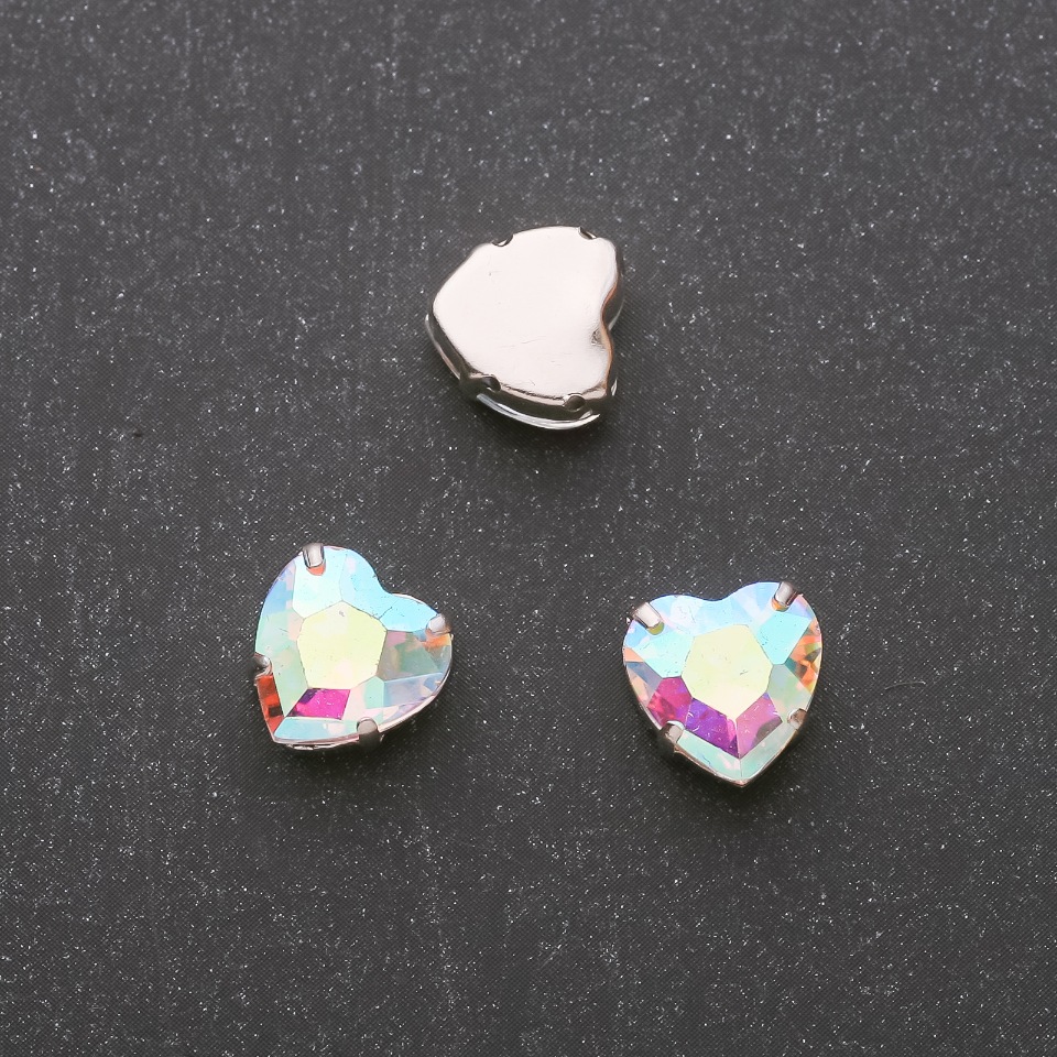 Price per pack / 10 pcs. Sew-on crystal in cap, Heart-shaped 14mm iridescent