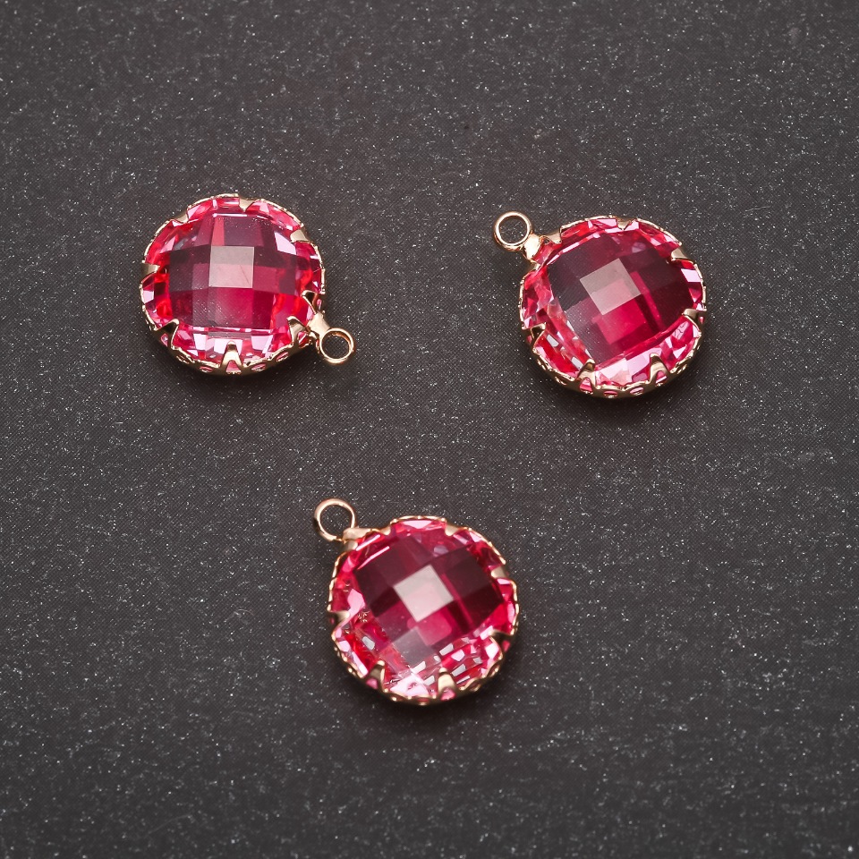 Pendant "Circle" in pink color with a gold-tone setting, 10x17 mm