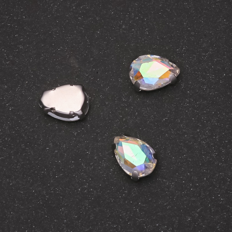 Price per pack / 10 pcs. Drop-shaped sew-on crystal with cap 7×10 mm iridescent