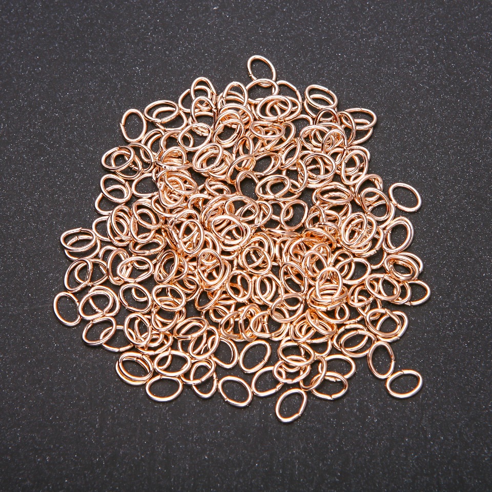 Connecting oval rings, 5x7 mm, 20 g pack, gold color