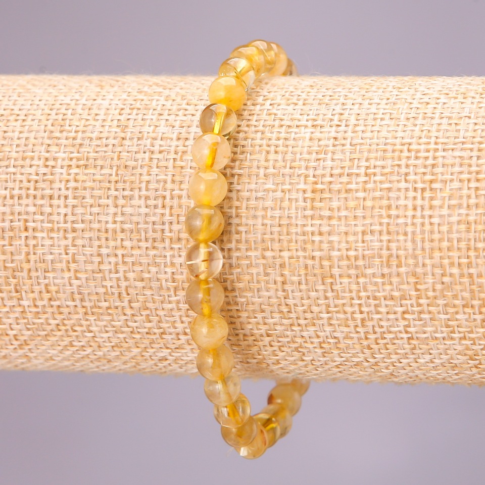 Bracelet made of natural rutilated quartz on elastic, smooth beads, diameter 6(±) mm, length 18 cm