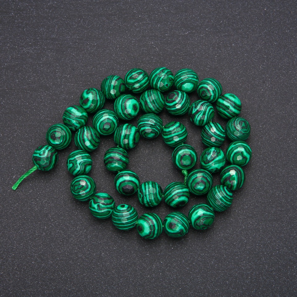 Malachite beads (pressed) faceted ball, diameter 10 mm (+/-), length 38 cm