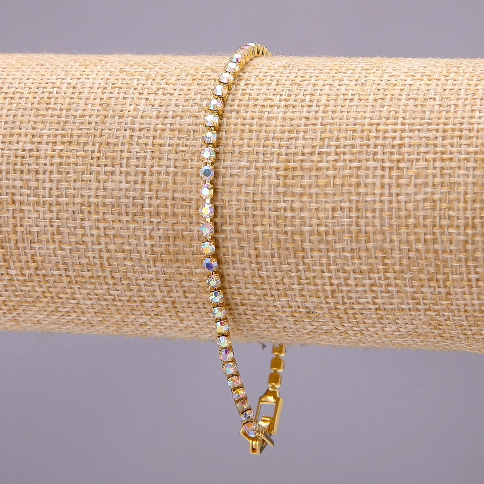 One-row rhinestone bracelet with a clasp, metal color 'gold', length 20 cm, width 3 mm